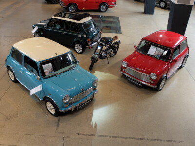 Metorbike inside three Classic Minis